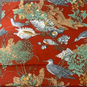 Vintage Avery cotton fabric sandpipers, seashells, and driftwood in rust-orange